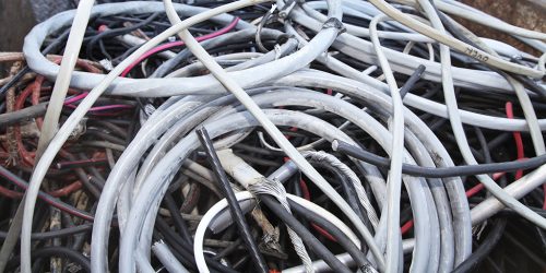 This insulated wire consists of solid strands of aluminum without any insulation. The wire can have some dirt or oil on it.